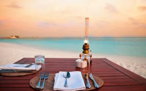 Candlelight dinner at the beach Stock Photos
