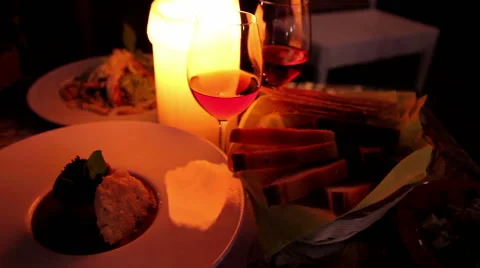 Candlelight dinner, two glasses of wine and snacks Video stock 60245774