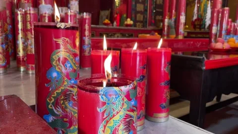 Candlelight illuminates the altar table of the monastery Stock Footage 288432174