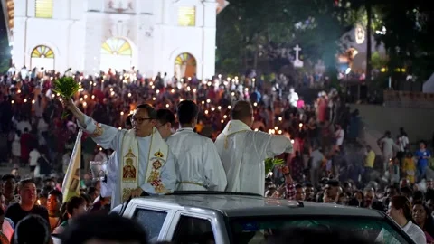 Candlelight illuminates the sacred path of the St. Anne Festival pilgrimage. 動画素材 318101910