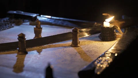 Candlelight war map in medieval times. 動画素材 202150805