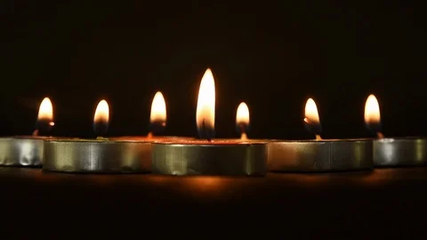 Candlelights in a black background Stock Footage 120526321