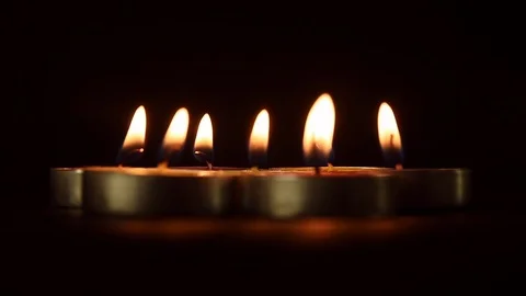 Candlelights in black background Stock Footage 121186584