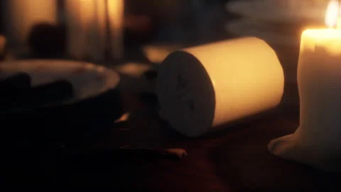 Candlelit Table Setting With Rustic Elements and Warm Ambiance Stock Footage 346692317