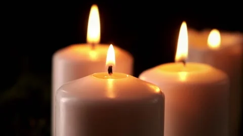 Candles on advent. The four candle on dark background with garland bokeh. Stock Footage 166385680