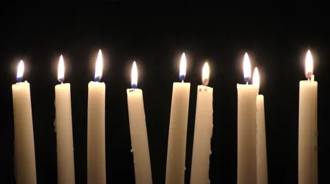 Candles against black background Stock Footage 57667932
