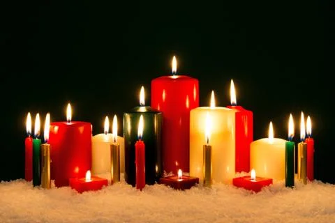 Candles against black background. Stock Photos