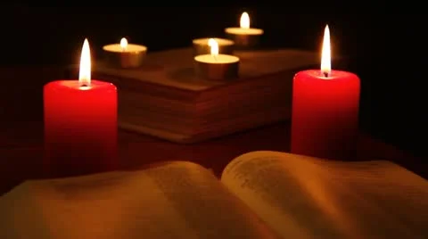 Candles and books in the dark Stock Footage 12016308
