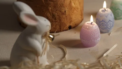 Candles and decoration around Easter Pie on a wooden table Stock Footage 87511490