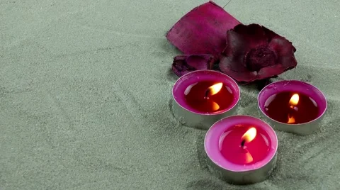 Candles and dry flower on the sand Stock Footage 59711041