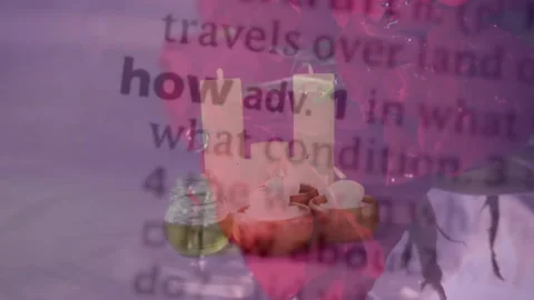 Candles and essential oils with dictionary text overlay on pink background 스톡 동영상 303443695