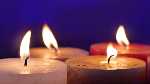Candles and flames. Blue background. Stock Footage 99437731