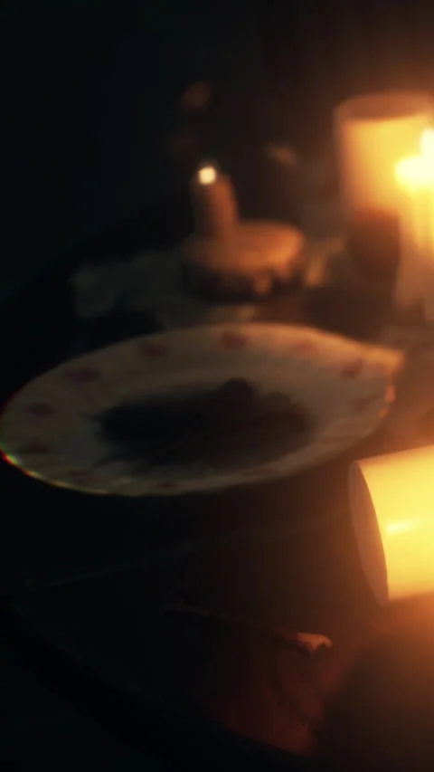 Candles and food set on a table during evening gathering Stock Footage 342658049