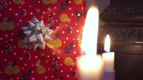 Candles and gift on black background. Stock Footage 258396914