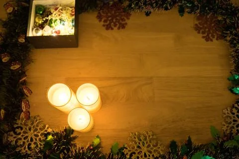 Candles and Gift Box Within Full Garland Frame Stock Photos