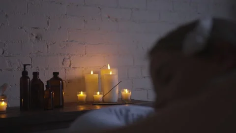 Candles and Lotion on a Table at a Day Spa Stock Footage 208708486