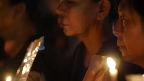 Candles and Portrait Held During King Rama IX Memorial Vigil Stock Footage 329832144