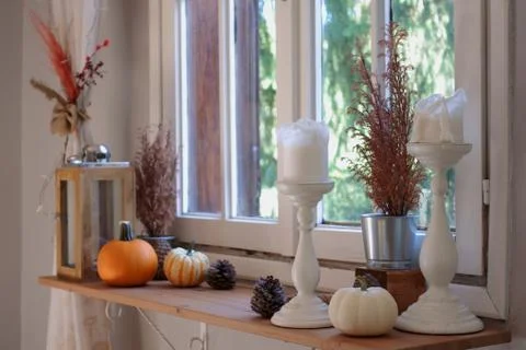 Candles and pumpkins Stock Photos