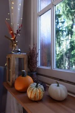 Candles and pumpkins Stock Photos