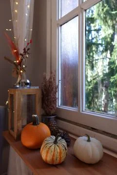 Candles and pumpkins Stock Photos