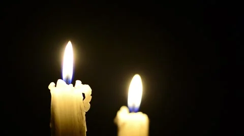 Candles and wind, blinking flame Stock Footage 48576424