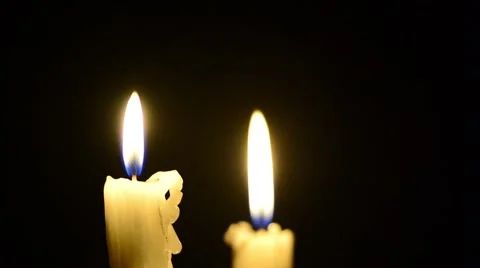 Candles and wind, blinking flame Stock Footage 48576475