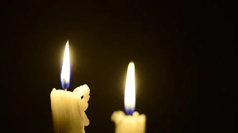Candles and wind, blinking flame Stock Footage 48576531