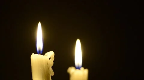 Candles and wind, blinking flame Stock Footage 48576597