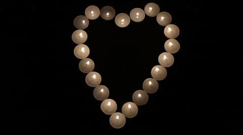 Candles arranged in a heart shape Stock Footage 60355673