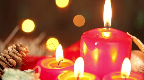 Candles on the background of garlands blinking. Christmas still life Stock Footage 67358149