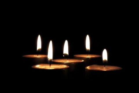 Candles on black background 2 Stock Photos