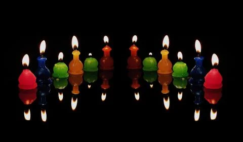 Candles on a black background Stock Photos