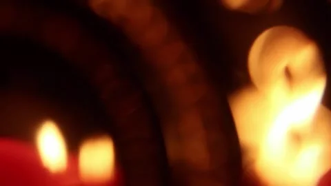 Candles blinking in the wind and reflection on the blurry background Stock Footage 164482400
