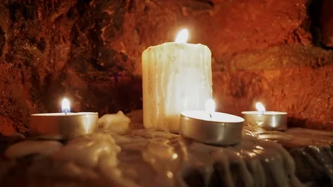 Candles burn in the dark Stock Footage 82955390