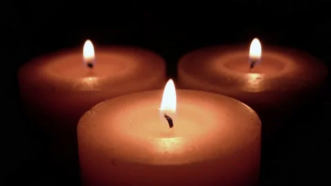 Candles burn in the dark Stock Footage 147337448