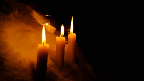 Candles burn in the snow soft-focus for your Various Religious, Romantic and Stock Footage 102103953