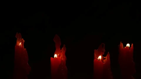Candles burning against dark black background, copy space. Stock Footage 304580705