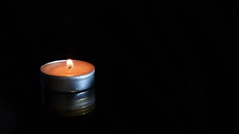 Candles burning on black background. Minimalism. Stock Footage 167789880