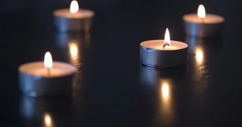 Candles Burning on a Black Table Stock Footage 101370485