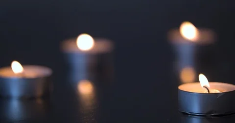 Candles Burning on a Black Table Stock Footage 101373963