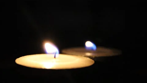 Candles burning in the dark Stock Footage 142164880