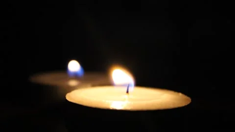 Candles burning in the dark Stock Footage 142165104