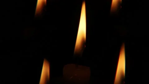 Candles burning in the dark Stock Footage 230226100