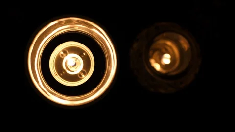 Candles burning light. Lit in Dark at Night. Round shape indoors. Top view. Stock Footage 128520402