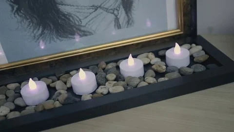 Candles burning next to the picture Stock Footage 76997879