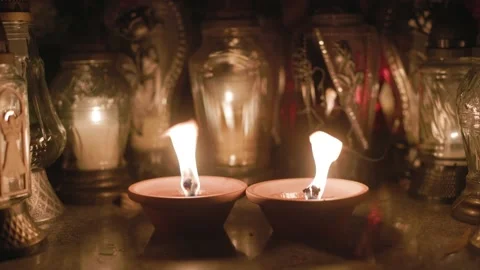 Candles burning in the wind at the cemetery Stock Footage 235466405