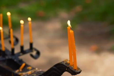 Candles on candlestick in the temple Stock Photos