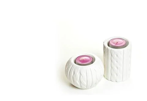 Candles in candlestick on a white background Stock Photos