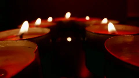 Candles close-up. The flight of the camera along the burning candles. Macro Stockbeeldmateriaal 244824513