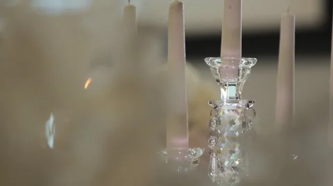 Candles on crystal candlestick with blurred background Stock Footage 62378920